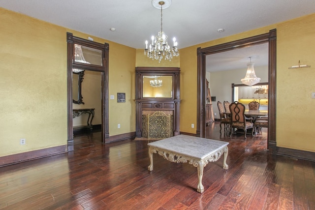 interior space featuring dark hardwood / wood-style flooring and an inviting chandelier