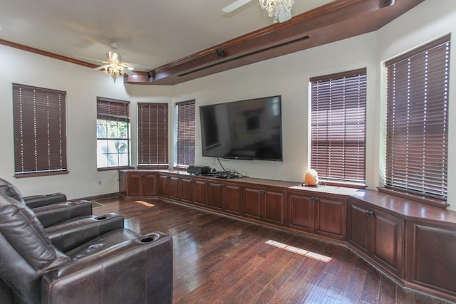 living room with dark hardwood / wood-style flooring, ceiling fan, and ornamental molding