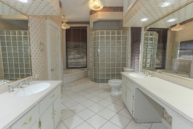 bathroom featuring a tub, tile patterned flooring, vanity, and toilet