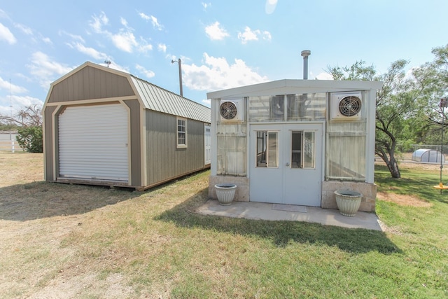 view of outdoor structure featuring a yard