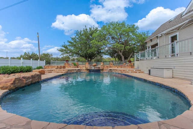 view of swimming pool with a patio area and pool water feature