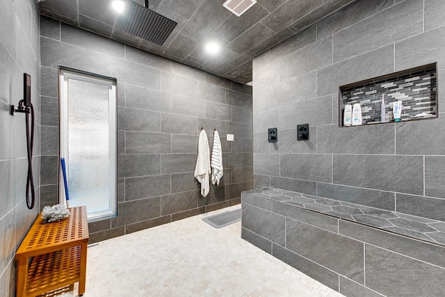 bathroom with tiled shower