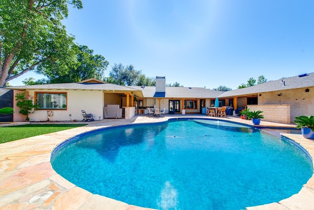 view of pool featuring a patio area