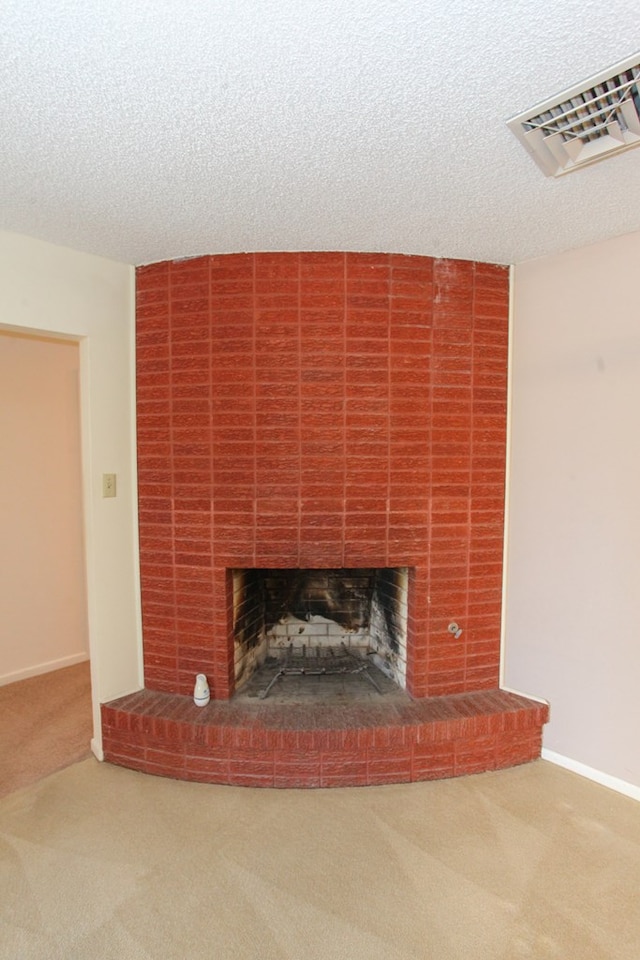 1900 Goliad St, Big Spring, TX 79720 - detailed view of carpet flooring, a fireplace, a textured ceiling, and baseboards