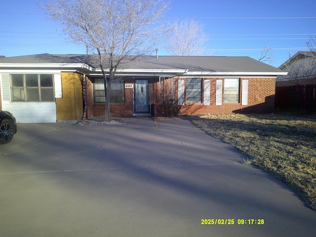 ranch-style house with brick siding