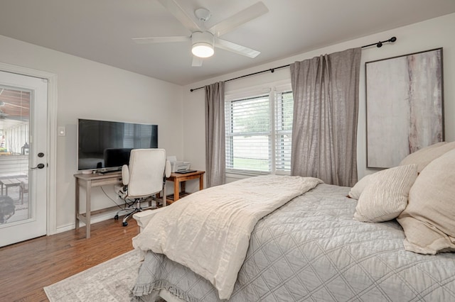 2602 N L St, Midland, TX 79705 - bedroom featuring wood finished floors, baseboards, ceiling fan, and access to exterior