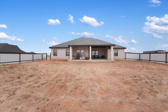 rear view of house featuring a patio area