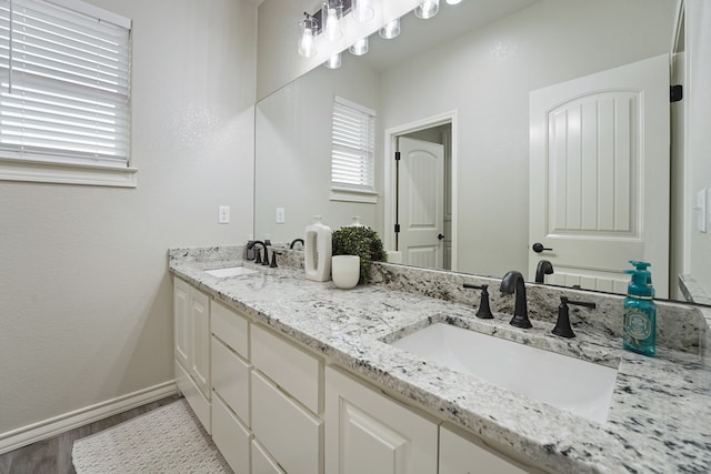 bathroom featuring vanity and hardwood / wood-style flooring