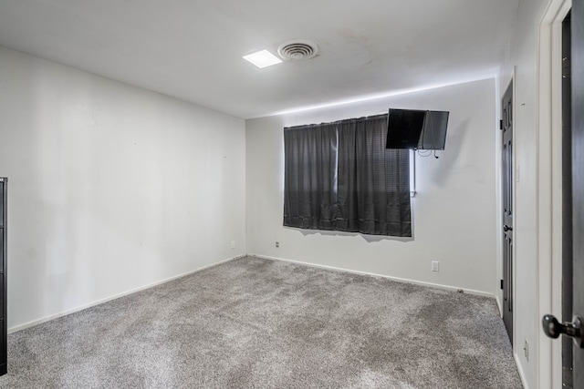 carpeted empty room with baseboards and visible vents