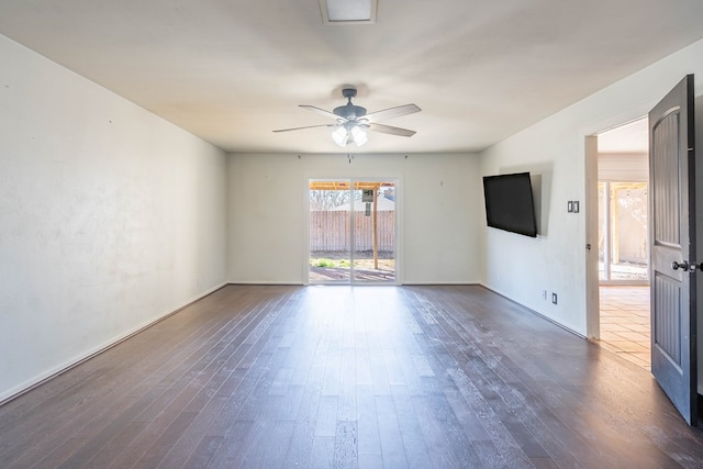 unfurnished room with ceiling fan and dark wood finished floors