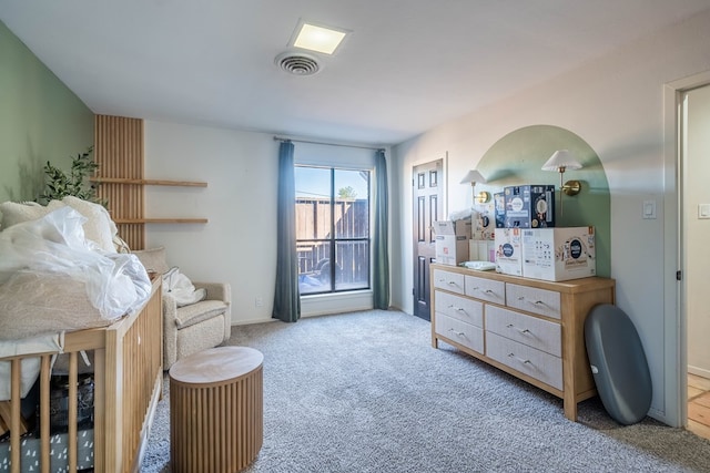 bedroom with light colored carpet and visible vents