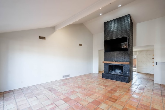 unfurnished living room with high vaulted ceiling, beamed ceiling, a brick fireplace, and visible vents