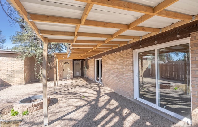 view of patio / terrace with a fire pit