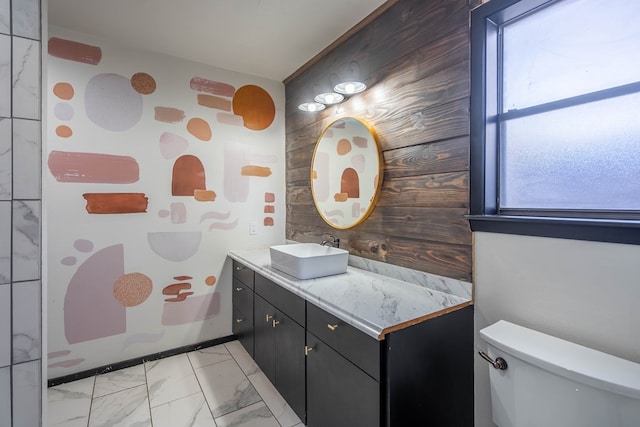 bathroom featuring marble finish floor, vanity, and toilet