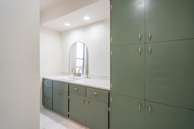 bathroom featuring recessed lighting, marble finish floor, and vanity