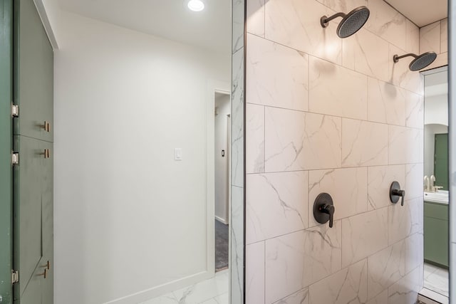 full bathroom featuring marble finish floor and a shower stall