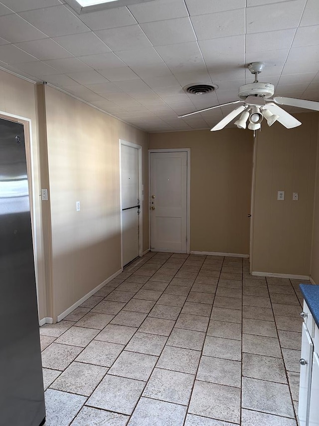 unfurnished room with ceiling fan