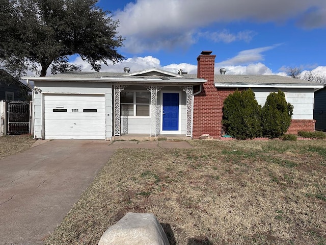 ranch-style house featuring a garage