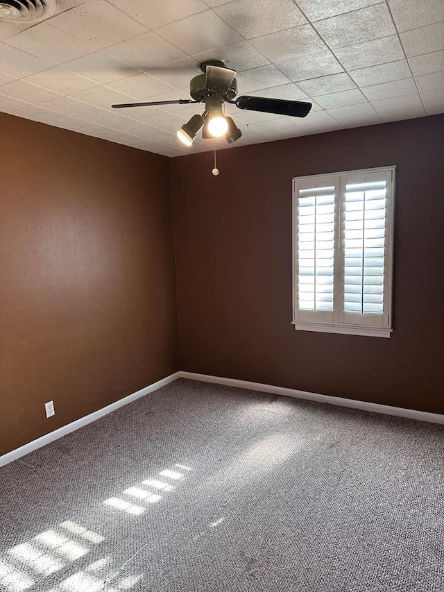 spare room with carpet flooring and ceiling fan