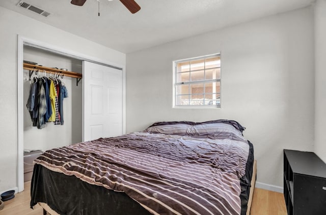 2401 Morrison Dr, Big Spring, TX 79720 - bedroom with light wood finished floors, visible vents, a closet, and a ceiling fan