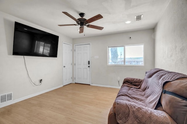 2401 Morrison Dr, Big Spring, TX 79720 - living area with light wood finished floors, baseboards, visible vents, and ceiling fan