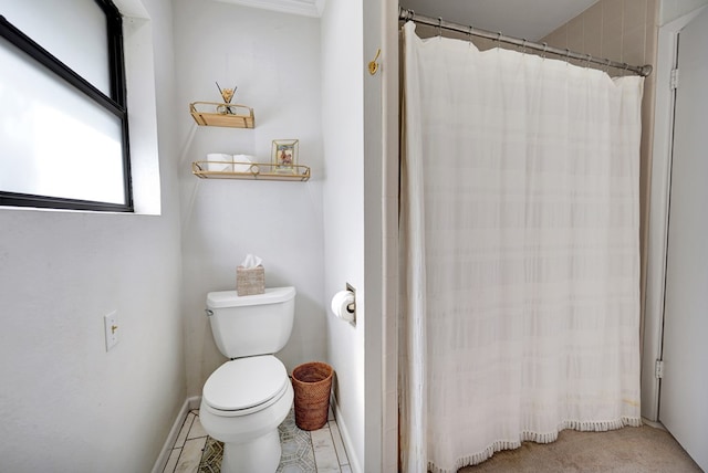 907 Harvard Ave, Midland, TX 79701 - bathroom with toilet and a shower with shower curtain