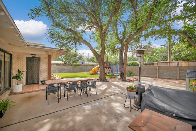 907 Harvard Ave, Midland, TX 79701 - fenced backyard with a playground, a patio area, and outdoor dining area