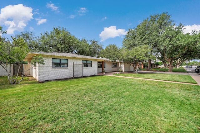907 Harvard Ave, Midland, TX 79701 - single story home with an attached garage, brick siding, and driveway