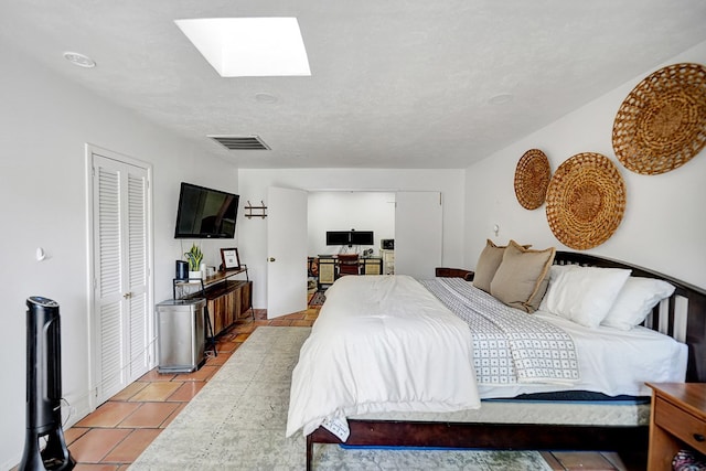 907 Harvard Ave, Midland, TX 79701 - bedroom with a skylight and light tile patterned floors