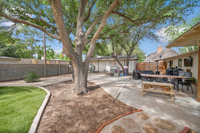 907 Harvard Ave, Midland, TX 79701 - fenced backyard featuring a patio and outdoor dining space