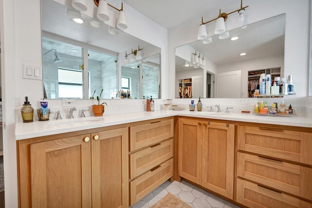 907 Harvard Ave, Midland, TX 79701 - bathroom featuring a walk in closet, tile patterned floors, double vanity, and a shower