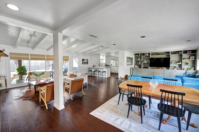 907 Harvard Ave, Midland, TX 79701 - dining room featuring beam ceiling, wood-type flooring, and rail lighting