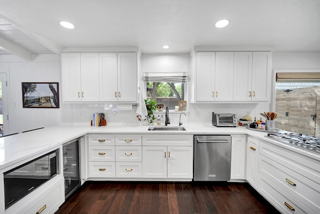 907 Harvard Ave, Midland, TX 79701 - kitchen with a sink, appliances with stainless steel finishes, dark wood finished floors, backsplash, and recessed lighting