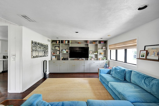 907 Harvard Ave, Midland, TX 79701 - living room with dark wood-type flooring, ornamental molding, baseboards, and a textured ceiling