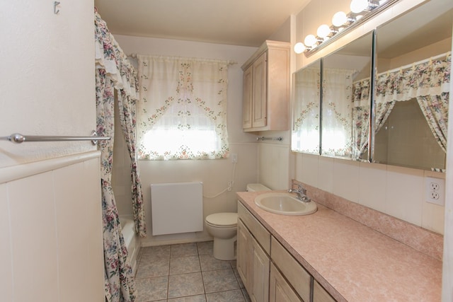 full bathroom with tile patterned flooring, vanity, shower / bathtub combination, and toilet