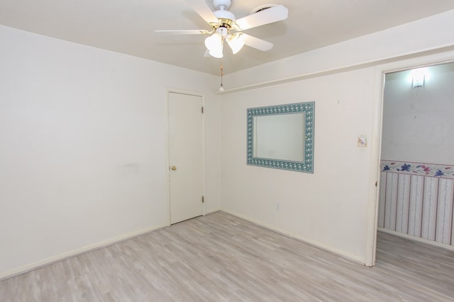 unfurnished room with ceiling fan and light hardwood / wood-style floors