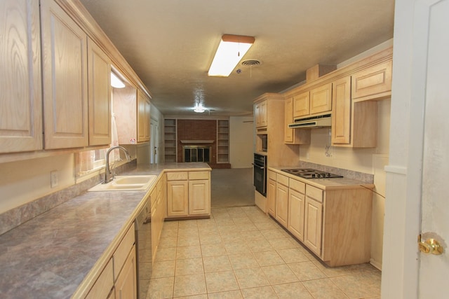 kitchen featuring cooktop, light brown cabinetry, black oven, and sink