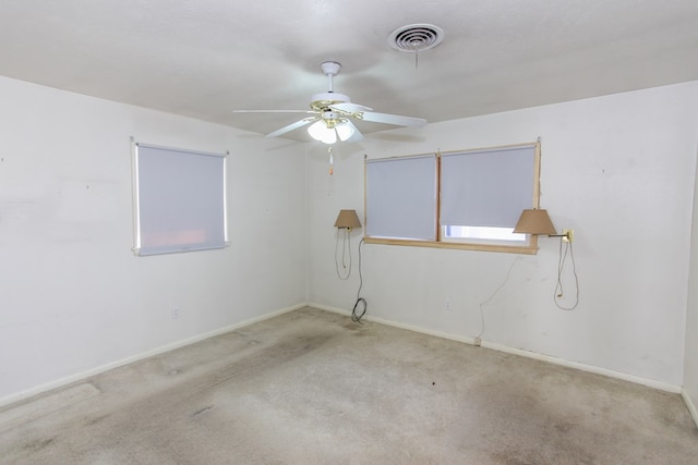 carpeted empty room with ceiling fan