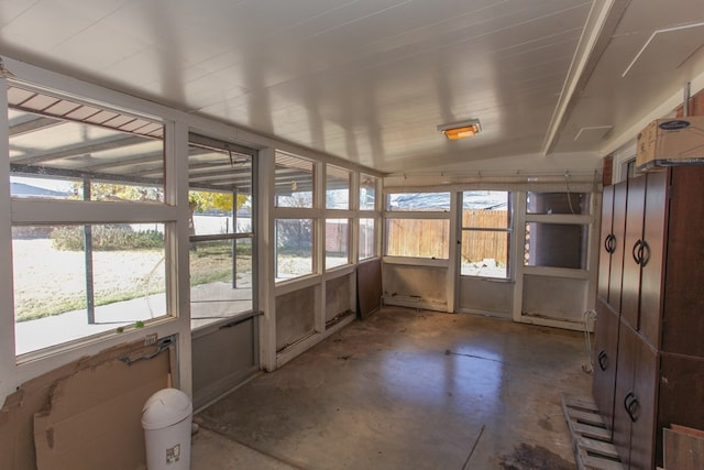 unfurnished sunroom with plenty of natural light and lofted ceiling