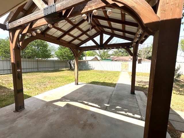 view of patio / terrace featuring a fenced backyard and a gazebo