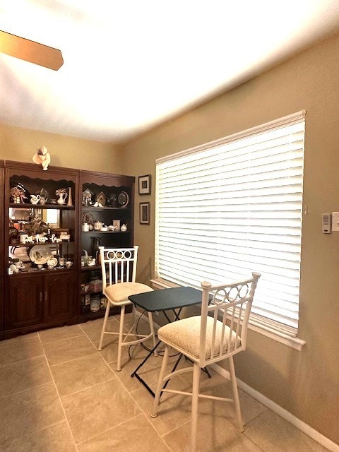 dining room with a healthy amount of sunlight and light tile patterned floors