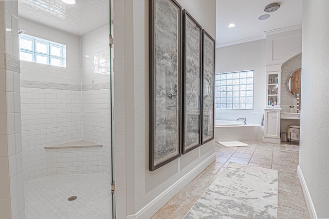 full bath with a garden tub, a shower stall, crown molding, recessed lighting, and baseboards