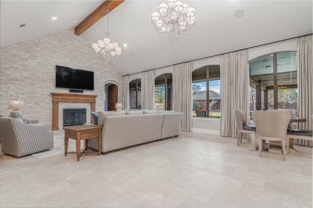 living area featuring a chandelier, high vaulted ceiling, visible vents, beamed ceiling, and a glass covered fireplace