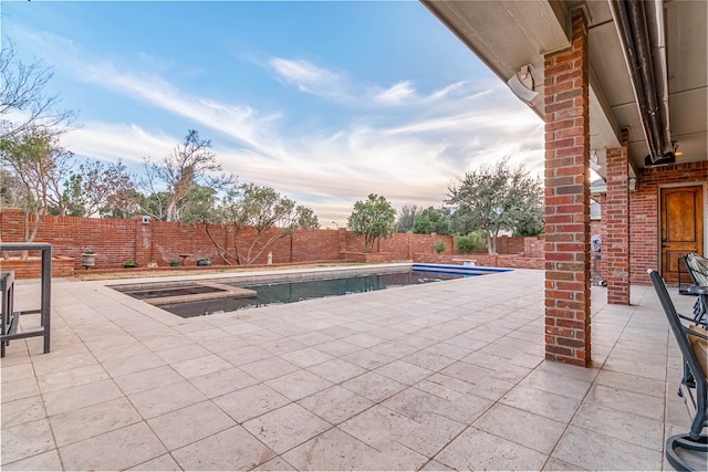 view of pool featuring a patio, a fenced backyard, and a fenced in pool