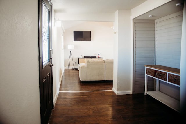 hall featuring dark wood-type flooring