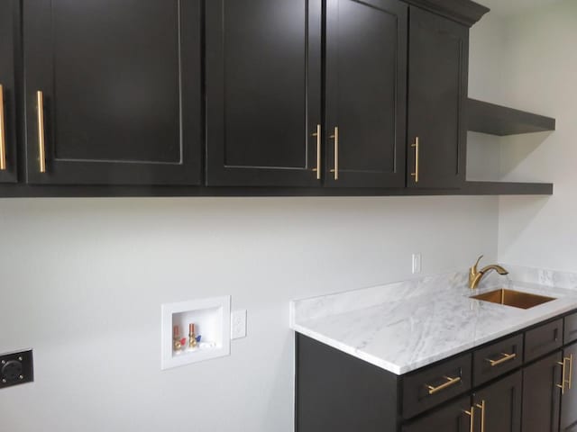 9811 E County Rd 108, Midland, TX 79706 - laundry area with hookup for an electric dryer, cabinet space, and hookup for a washing machine