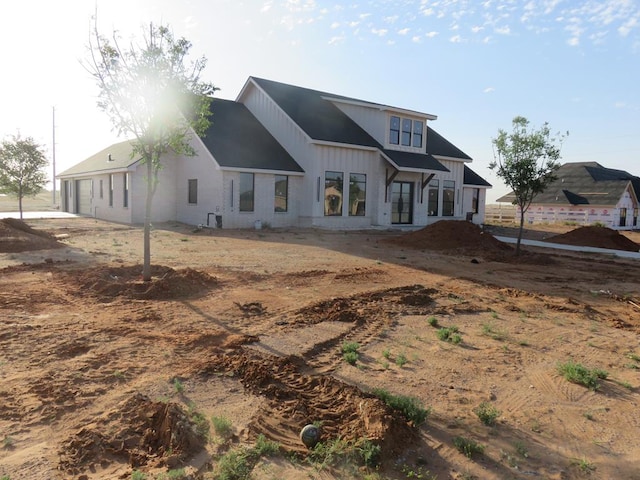 9811 E County Rd 108, Midland, TX 79706 - rear view of property with board and batten siding