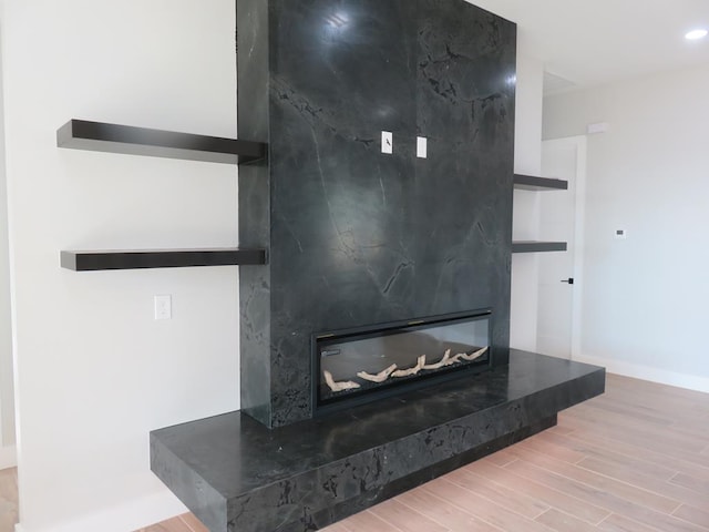 9811 E County Rd 108, Midland, TX 79706 - detailed view of wood finished floors and a large fireplace