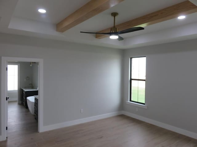 9811 E County Rd 108, Midland, TX 79706 - spare room with a ceiling fan, beam ceiling, light wood-style floors, and recessed lighting
