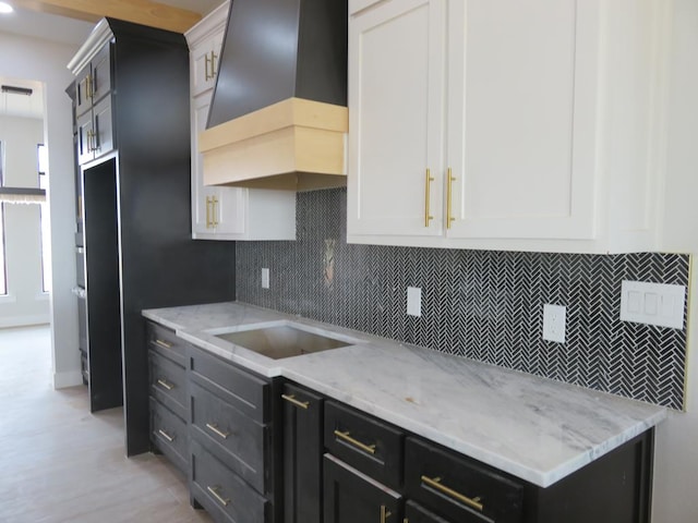 9811 E County Rd 108, Midland, TX 79706 - kitchen featuring custom exhaust hood and white cabinetry